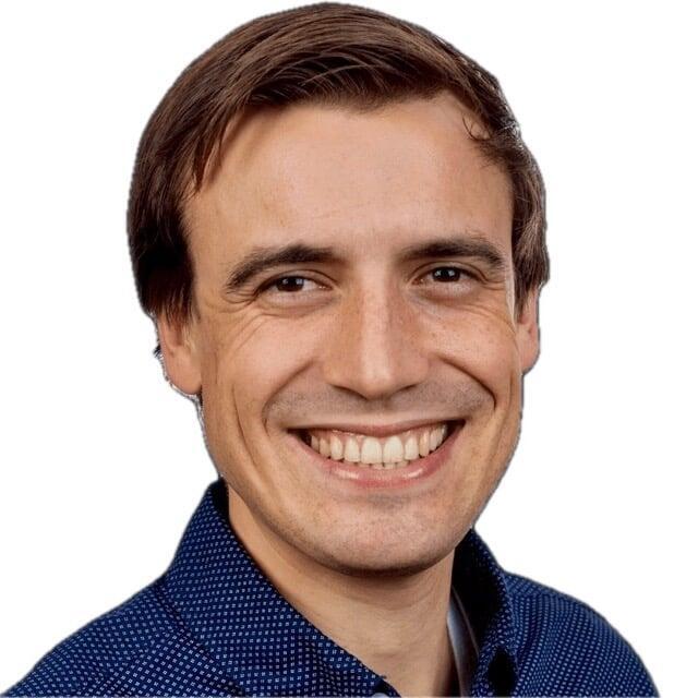 image of CEO Lionel Church wearing a blue collared shirt and smiling